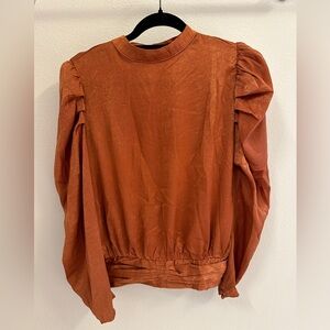 Beautiful velveteen blouse with ruched shoulders and bridal button detailing.